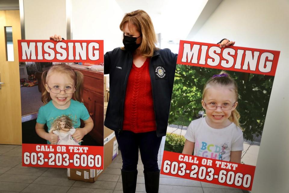 Manchester Police Public Information Officer Heather Hamel holds two reward posters, Tuesday, Jan. 4, 2022, in Manchester, NH (AP)