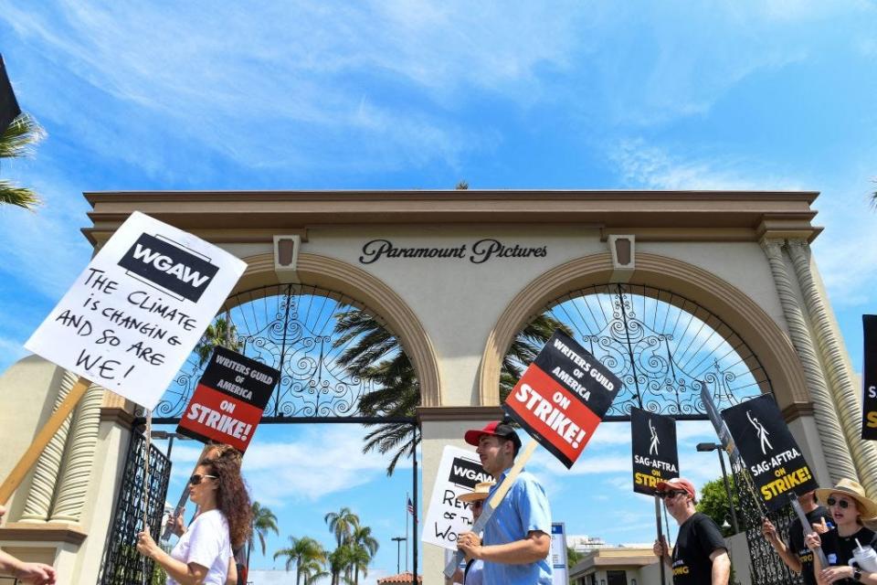 Members of the Writers Guild of America and the Screen Actors Guild walk a picket line outside of Paramount Pictures, in Los Angeles, California, on July 21, 2023. Tens of thousands of Hollywood actors went on strike at midnight on July 14, 2023, effectively bringing the giant movie and television business to a halt as they join writers in the first industry-wide walkout in 63 years.