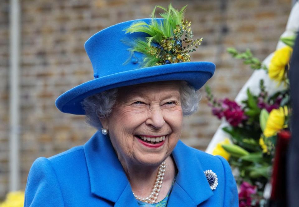 Queen Elizabeth II reacts as she visits the Haig Housing Trust in Morden in 2019 (AFP/Getty)