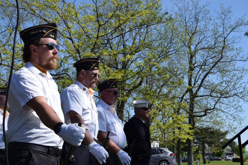 Members of the American Legion Post 194 stand along the stage during the 2023 Memorial Day ceremony at Pennsylvania Park in Petoskey on Monday.