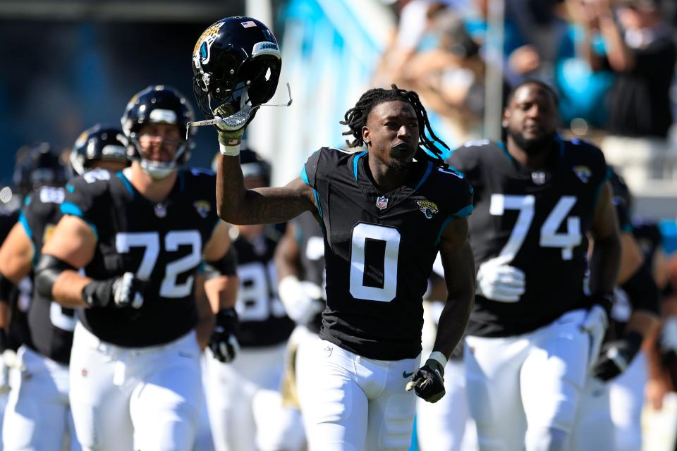 Jacksonville Jaguars wide receiver Calvin Ridley (0) leads his team onto the field before an NFL football matchup Sunday, Nov. 19, 2023 at EverBank Stadium in Jacksonville, Fla. The Jacksonville Jaguars defeated the Tennessee Titans 34-14. [Corey Perrine/Florida Times-Union]