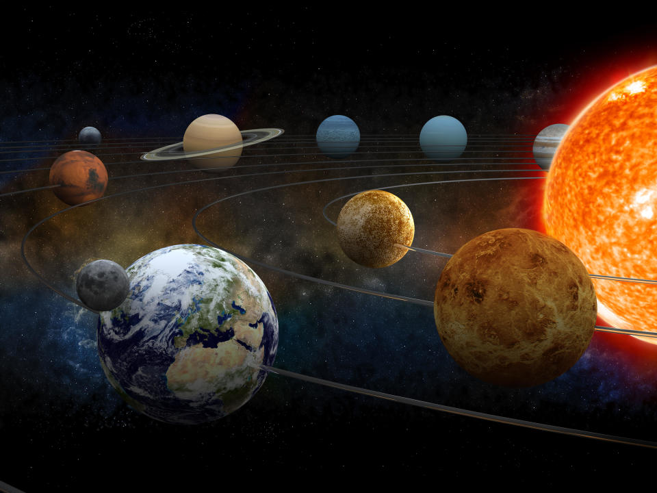 The sun and nine planets of our system orbiting in an illustration.  / Credit: Getty Images