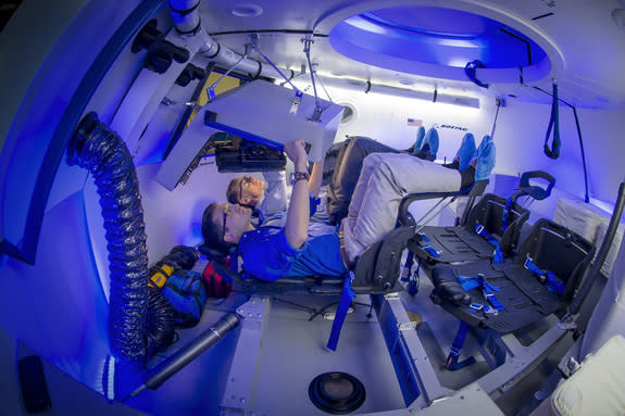 A look inside the interior of Boeing's commercial CST-100 space capsule for astronaut trips to and from low-Earth orbit.