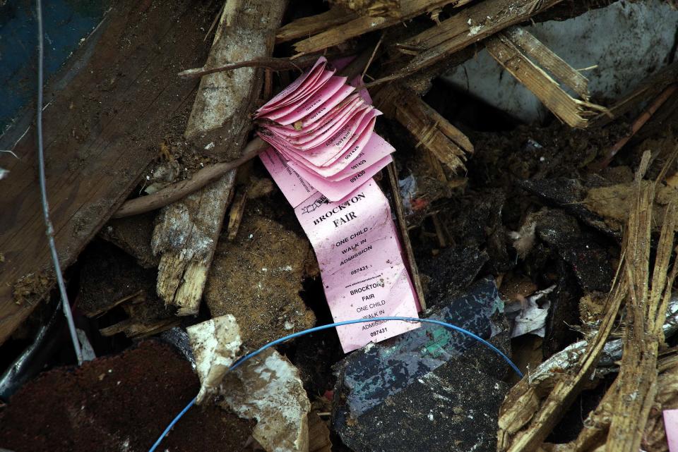 Old tickets to the Brockton Fair amongst the rubble of the demolished Brockton Fairgrounds grandstand on Wednesday,  July 19, 2023.