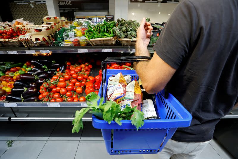 A customer shops in a supermarket in Nice