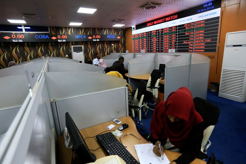 People work at Khartoum Stock Exchange in Khartoum