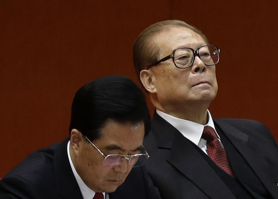 Former Chinese President Jiang Zemin, right, and Chinese President Hu Jintao attend the closing ceremony of the 18th Communist Party Congress held at the Great Hall of the People in Beijing Wednesday, Nov. 14, 2012. (AP Photo/Vincent Yu)