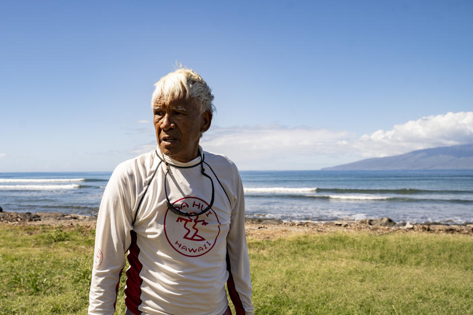 Abraham "Snake" Ah Hee, one of the first crew members of Hokulea - the Polynesian double-hulled voyaging canoe, is pictured at Launiupoko Beach Park on Friday, Feb. 23, 2024, in Lahaina, Hawaii. Ah Hee said he has noticed there has been less limu (seaweed) after last year's fire. (AP Photo/Mengshin Lin)