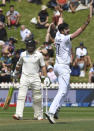 India's Ishant Sharma, right, successfully appeals the wicket of New Zealand's Tom Latham for 11 during the first cricket test between India and New Zealand at the Basin Reserve in Wellington, New Zealand, Saturday, Feb. 22, 2020. (AP Photo/Ross Setford)