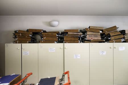 Tax archives are seen piled up inside a tax office in Athens, Greece, June 25, 2015. REUTERS/Alkis Konstantinidis