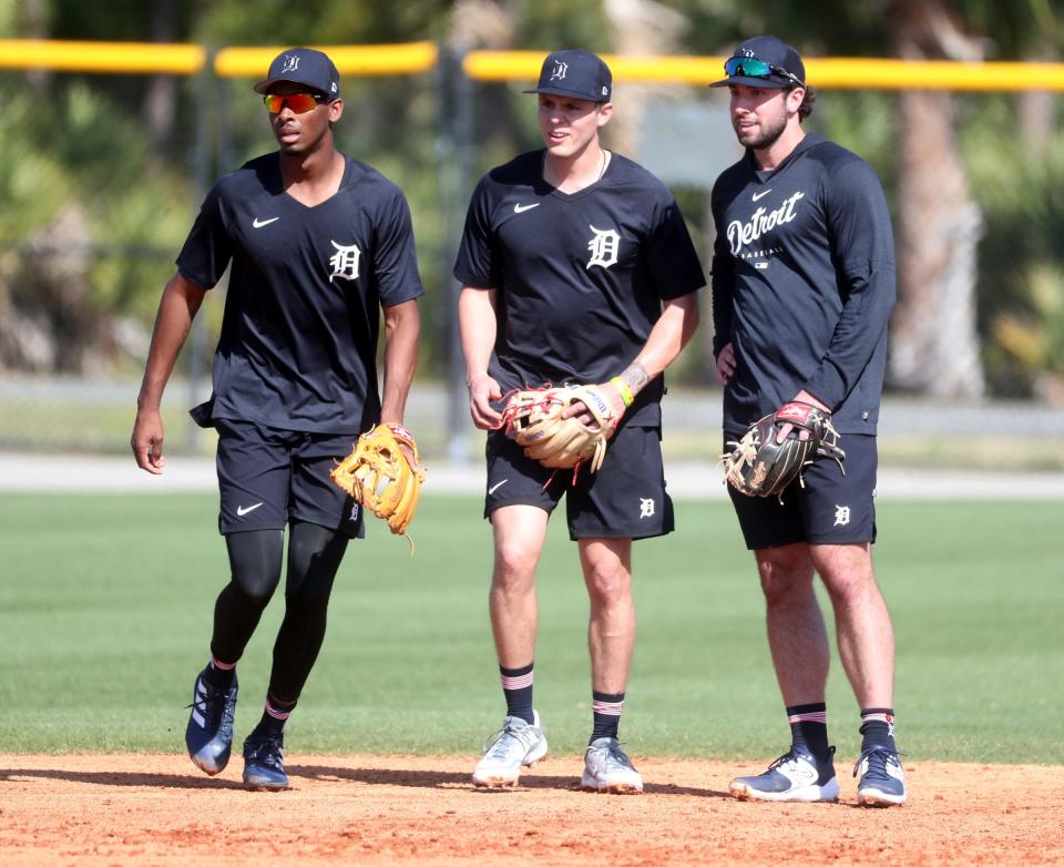 (From left) Tigers infielders Brendon Davis, Nick Maton and Matt Vierling wait to field ground balls during spring training on Friday, Feb. 17, 2023, in Lakeland, Florida.