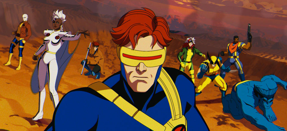 (L-R): Morph (voiced by JP Karliak), Storm (voiced by Alison Sealy-Smith), Gambit (voiced by AJ LoCascio), Cyclops (voiced by Ray Chase), Rogue (voiced by Lenore Zann), Wolverine (voiced by Cal Dodd), Bishop (voiced by Isaac Robinson-Smith), Beast (voiced by George Buza) in Marvel Animation's X-MEN '97. Photo courtesy of Marvel Animation. © 2024 MARVEL.