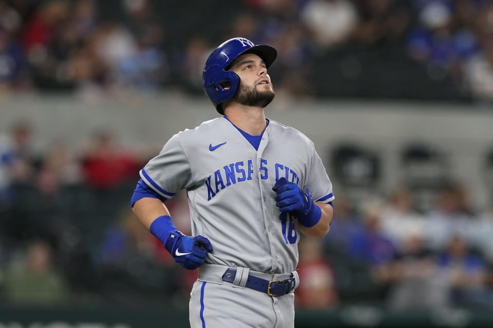 Kansas City Royals Andrew Benintendi watches his flyout during the second inning of the team's baseball against the Texas Rangers in Arlington, Texas, Thursday, May 12, 2022. (AP Photo/LM Otero)