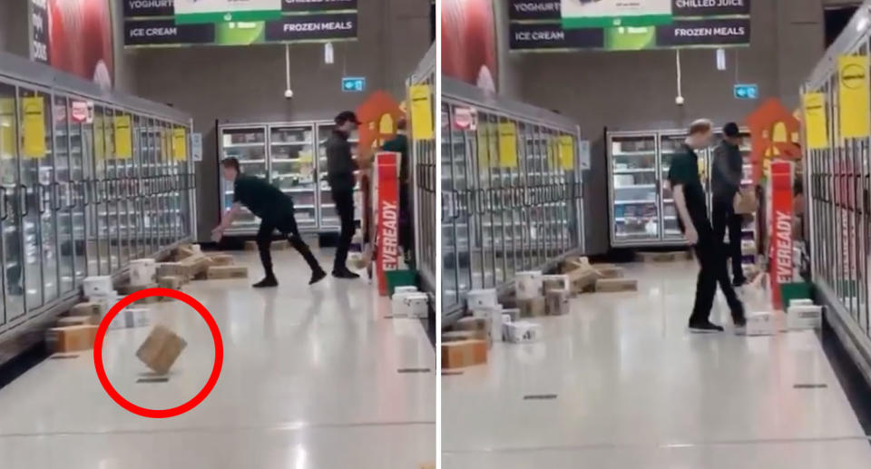 One male worker in the Banyo store throws a box down the aisle, while another (right) kicks a box towards a freezer. 