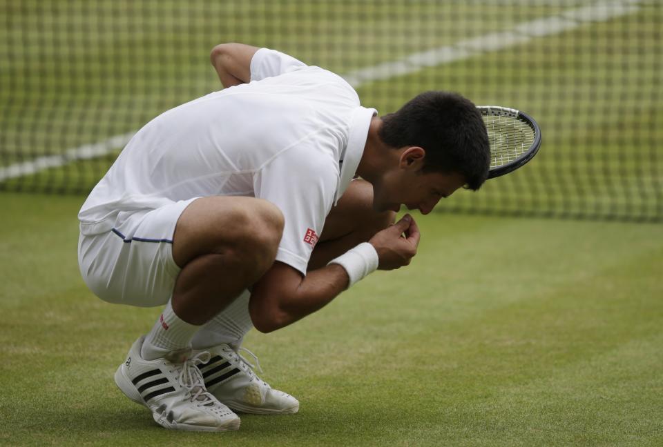 FILE - In this July 12, 2015, file photo, Novak Djokovic of Serbia celebrates winning the men's singles final against Roger Federer of Switzerland at the All England Lawn Tennis Championships in Wimbledon, London. Djokovic won the match 7-6, 6-7, 6-4, 6-3. (AP Photo/Pavel Golovkin, File)