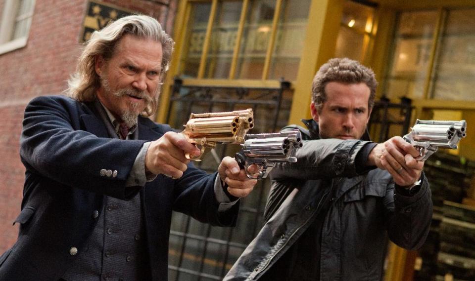 This film publicity image released by Universal Pictures shows Jeff Bridges, left, and Ryan Reynolds in a scene from "R.I.P.D." (AP Photo/Universal Pictures, Scott Garfield, File)