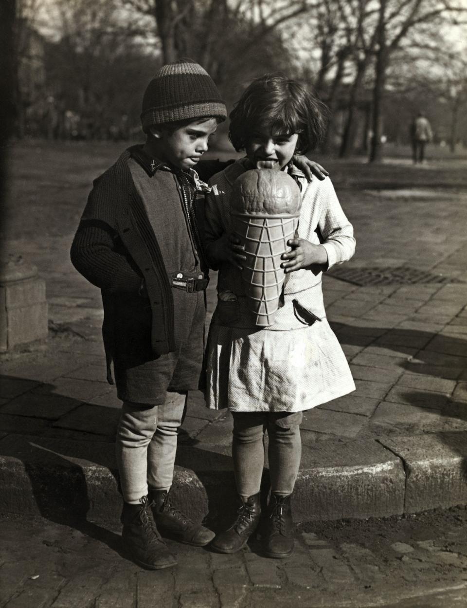 <h1 class="title">Boy Sharing Giant Ice Cream Cone with Girl</h1><cite class="credit">Photo by George Rinhart/Corbis via Getty Images</cite>