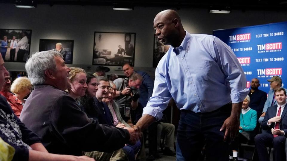 Sen. Tim Scott, R-S.C., shakes hands with guest following a town hall, Monday, May 8, 2023, in Manchester, N.H. Scott recently launched an exploratory committee for a 2024 GOP presidential bid, a step that comes just shy of making his campaign official.