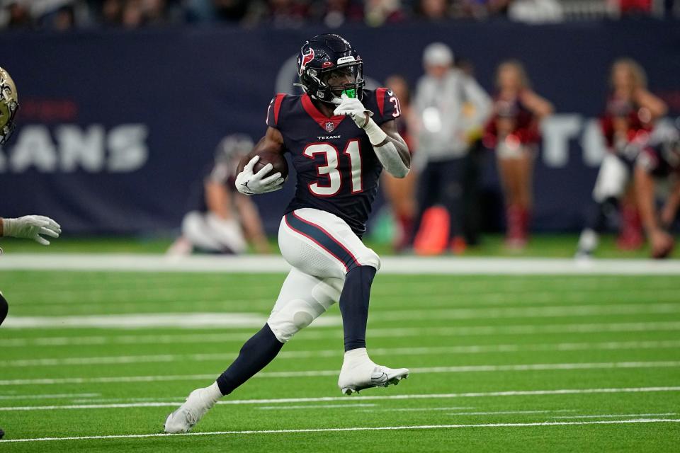 Houston Texans running back Dameon Pierce (31) runs for a first down against the New Orleans Saints during the first half of an NFL preseason football game Saturday, Aug. 13, 2022, in Houston. (AP Photo/David J. Phillip)