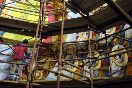 A worker takes part in the renovation work of Saint Mark's Coptic Orthodox Cathedral in Cairo, Egypt, October 28, 2018. REUTERS/Shokry Hussein/File Photo