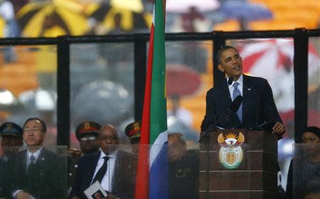 U.S. President Barack Obama delivers his speech at the memorial service for late South African President Nelson Mandela at the FNB soccer stadium in Johannesburg December 10, 2013. World leaders, from U.S. President Barack Obama to Cuba's Raul Castro, will pay homage to Mandela at the memorial that will recall his gift for bringing enemies together across political and racial divides. REUTERS/Kai Pfaffenbach