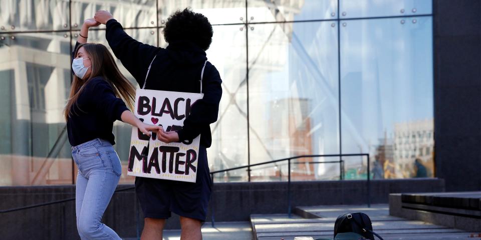 BOSTON, MA - NOVEMBER 8: People dance during a Black Lives Matter rally at Boston City Hall in Boston on Nov. 8, 2020. On Nov. 7, the 2020 presidential election was called, with Joe Biden named president-elect. (Photo by Jessica Rinaldi/The Boston Globe via Getty Images)