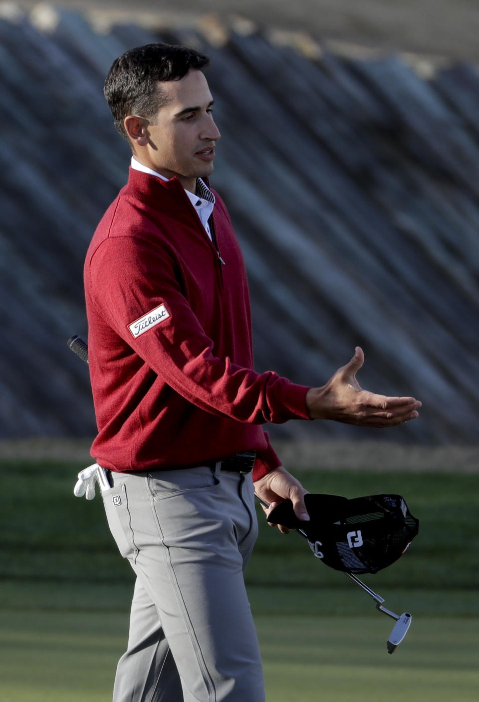 Dominic Bozzelli shakes hands on the ninth green after posting an 8-under par first round in the CareerBuilder Challenge golf tournament at the Stadium Course at PGA West on Thursday, Jan. 19, 2017, in La Quinta, Calif. (AP Photo/Chris Carlson)