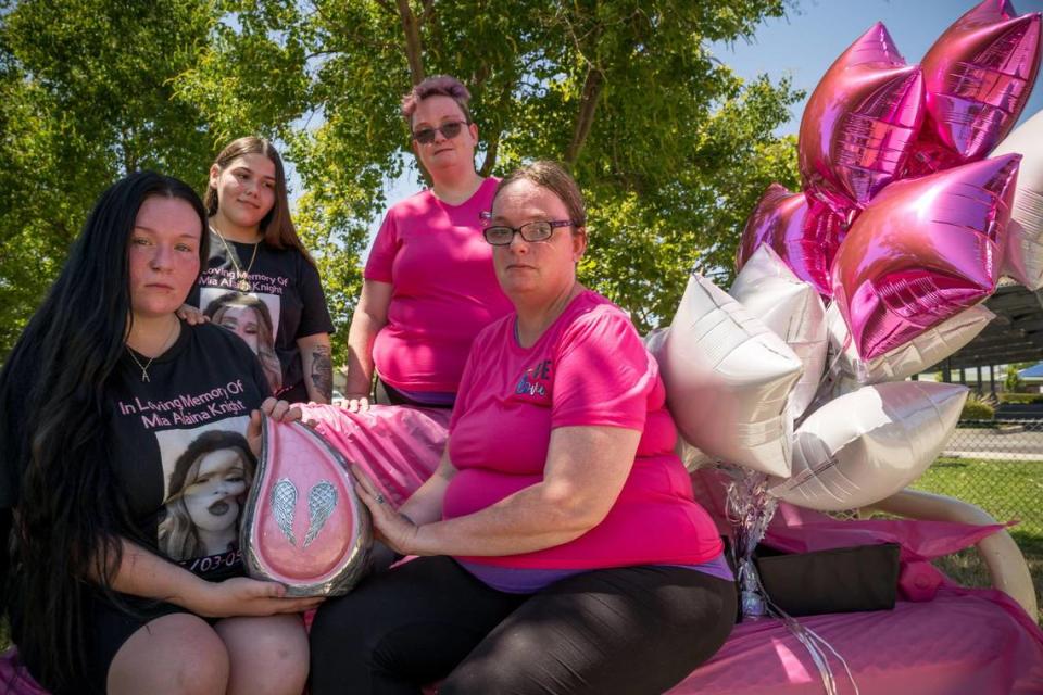 Kylee Stone, left, and Opál McCartney hold Mia Alaina-Lorene Knight’s urn while, Kylee Stone and Jasmine Mederos, 17, and Jennique Lee stand behind them while remembering Knight at POW/MIA Park on July 1, 2023, in Linda. “This is a place that Mia came to when Mia wasn’t feeling safe, this where she ran to,” McCartney said.