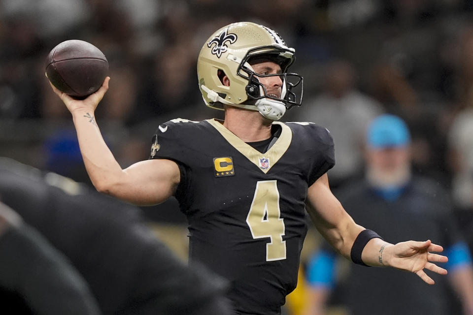 New Orleans Saints quarterback Derek Carr (4) looks to throw the ball during the first half of an NFL football game against the Carolina Panthers, Sunday, Sept. 8, 2024, in New Orleans. (AP Photo/Gerald Herbert)