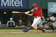 Texas Rangers Nick Solak connects for an RBI single during the first inning against the Seattle Mariners in a baseball game Friday, May 7, 2021, in Arlington, Texas. (AP Photo/Richard W. Rodriguez)