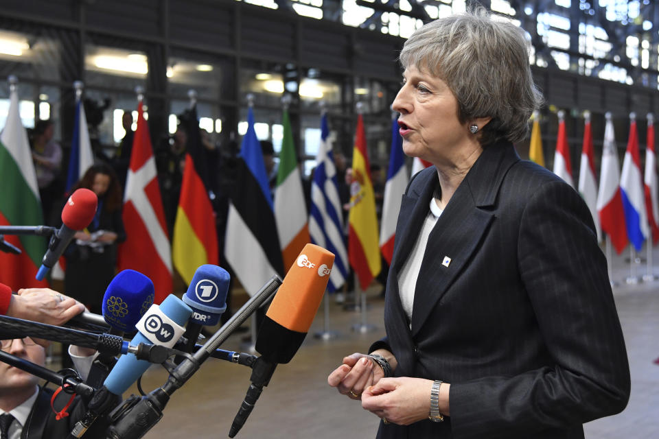 British Prime Minister Theresa May speaks with the media as she arrives for an EU summit in Brussels, Thursday, Dec. 13, 2018. EU leaders gather for a two-day summit, beginning Thursday, which will center on the Brexit negotiations. (AP Photo/Geert Vanden Wijngaert)