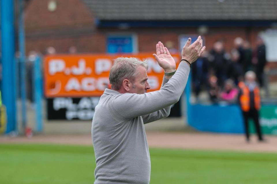 Paul Simpson applauds fans at the end of the game <i>(Image: Ben Holmes)</i>