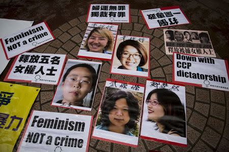 Portraits of Li Tingting (top L), Wei Tingting (top R), (bottom, L-R) Wang Man, Wu Rongrong and Zheng Churan are pictured during a protest calling for their release in Hong Kong April 11, 2015. REUTERS/Tyrone Siu