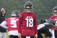 Atlanta Falcons quarterback Kirk Cousins runs drills during an NFL football mini training camp practice on Tuesday, May 14, 2024, in Flowery Branch, Ga. (AP Photo/Brynn Anderson)