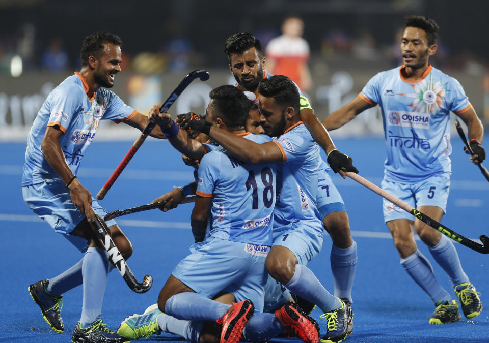 Indian players celebrate scoring a goal during the Men's Hockey World Cup quarterfinal match between India and Netherlands at Kalinga Stadium in Bhubaneswar, India, Thursday, Dec. 13, 2018. (AP Photo/Aijaz Rahi)