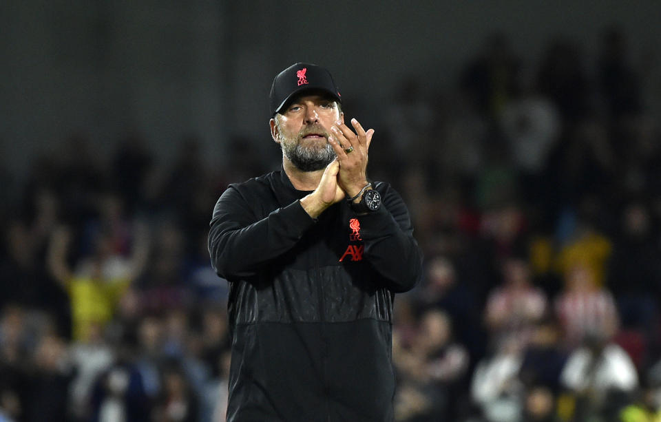 Liverpool's manager Jurgen Klopp applauds to supporters at the end of the English Premier League soccer match between Brentford and Liverpool at the Brentford Community Stadium in London, Saturday, Sept. 25, 2021. (AP Photo/Rui Vieira)