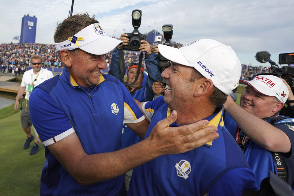 FILE - In this Sept. 30, 2018, file photo, Europe's Sergio Garcia, right, celebrates with Ian Poulter after Europe won the Ryder Cup on the final day of the 42nd Ryder Cup at Le Golf National in Saint-Quentin-en-Yvelines, outside Paris, France. The pandemic-delayed 2020 Ryder Cup returns the United States next week at Whistling Straits along the Wisconsin shores of Lake Michigan. (AP Photo/Laurent Cipriani, File)