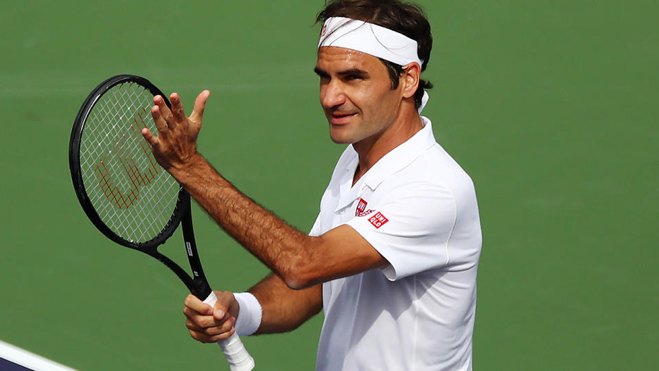 Roger Federer celebrates. (Photo by Yong Teck Lim/Getty Images)