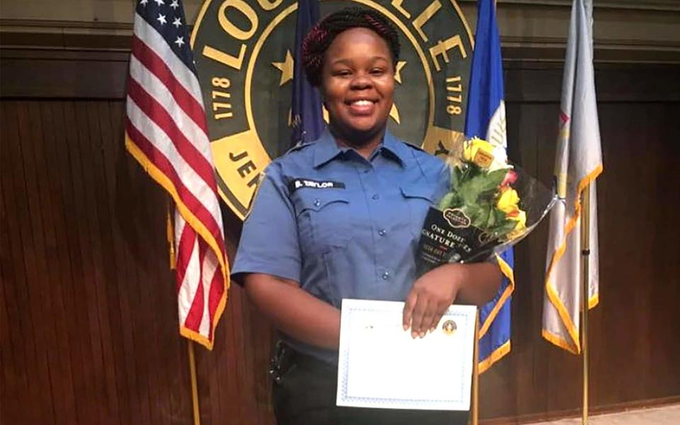 Breonna Taylor posing during a graduation ceremony in Louisville Kentucky. - AFP