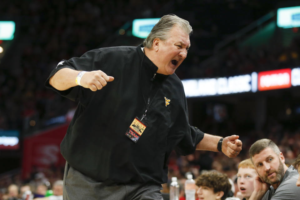West Virginia head coach Bob Huggins reacts to a play against Ohio State during the second half of an NCAA college basketball game Sunday, Dec. 29, 2019, in Cleveland. West Virginia defeated Ohio State 67-59. (AP Photo/Ron Schwane)