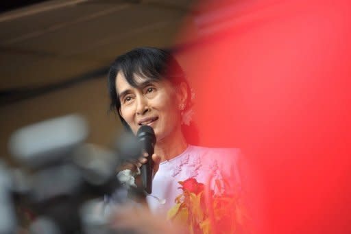 Myanmar opposition leader Aung San Suu Kyi addresses journalists in Yangon on April 2. Suu Kyi's party won 43 of the 44 seats it contested in parliamentary elections, according to official results announced by state television