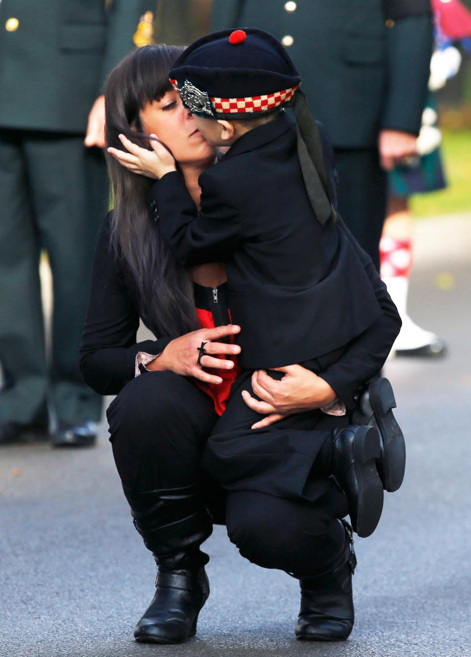 Marcus Cirillo, 5, is comforted by his aunt Natasha Cirillo during the funeral procession for his father, Cpl. Nathan Cirillo in Hamilton