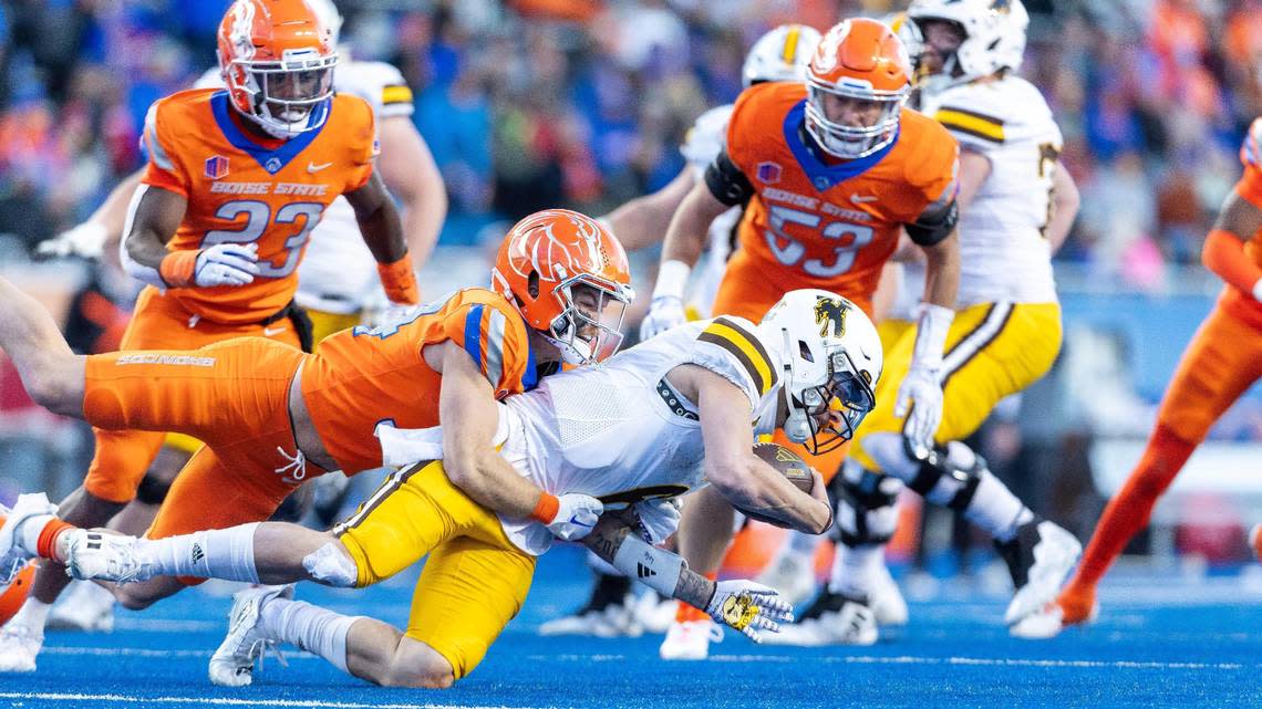 Boise State safety Alexander Teubner sacks Wyoming quarterback Andrew Peasley in the second half of their game at Albertsons Stadium, Saturday, Oct. 28, 2023.