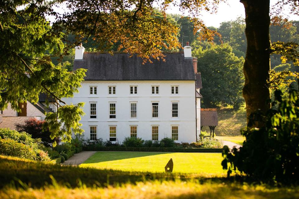 <p>This gorgeous hotel in Pembrokeshire overlooks the Preseli Hills and has plenty of countryside for dogs to roam freely. There are six dog-friendly rooms, most of which have access to a garden, along with dog-friendly tables in one section of the Artisan Restaurant. <br><br>The charge per dog per night is £20 and includes upcycled towels, a blanket and some special treats. And the resident labradoodle Bronwen is always ready to make new friends. For discerning dogs, a dining menu by Burns Real Food for Dogs can also be ordered from.</p><p><a class="link " href="https://www.countrylivingholidays.com/offers/pembrokeshire-the-grove-of-narbeth" rel="nofollow noopener" target="_blank" data-ylk="slk:READ OUR REVIEW AND BOOK;elm:context_link;itc:0;sec:content-canvas">READ OUR REVIEW AND BOOK</a></p><p><a class="link " href="https://www.booking.com/hotel/gb/the-grove-narberth.en-gb.html?aid=2070935&label=dog-friendly-hotels-uk" rel="nofollow noopener" target="_blank" data-ylk="slk:BOOK NOW;elm:context_link;itc:0;sec:content-canvas">BOOK NOW</a></p>