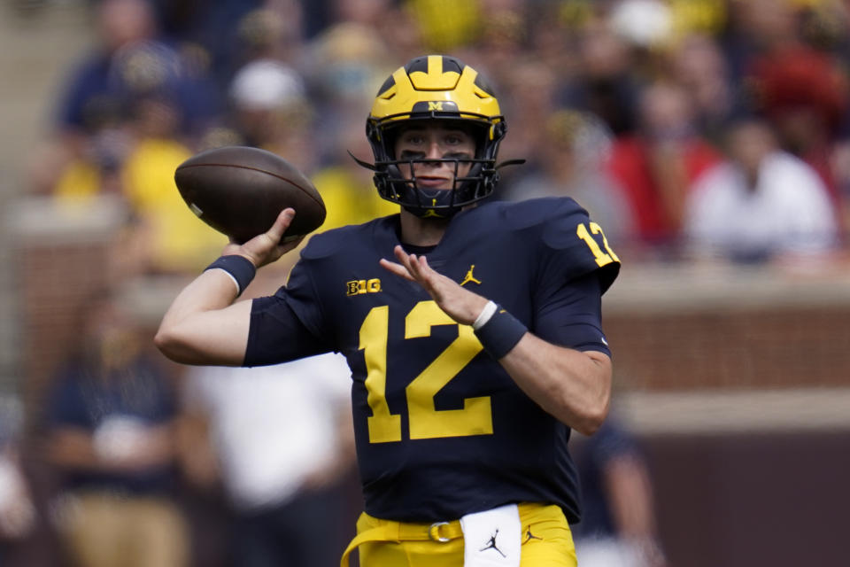 Michigan quarterback Cade McNamara (12) throws against Northern Illinois in the first half of a NCAA college football game in Ann Arbor, Mich., Saturday, Sept. 18, 2021. (AP Photo/Paul Sancya)