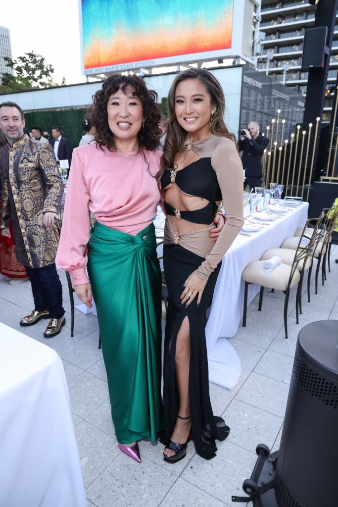 Sandra Oh and Ashley Park at the Gold Gala by Gold House held at the Dorothy Chandler Pavilion on May 6, 2023 in Los Angeles, California.