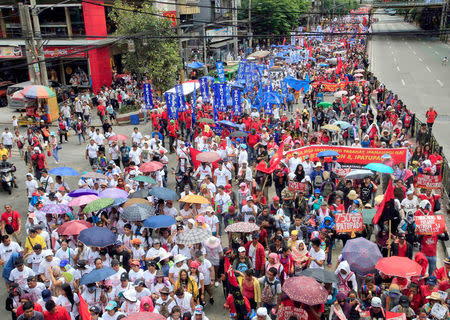 Thousands of Philippine workers carry placards while marching towards the Malacanang Presidential Palace during a May Day rally at Espana, metro Manila, Philippines May 1, 2018. REUTERS/Romeo Ranoco