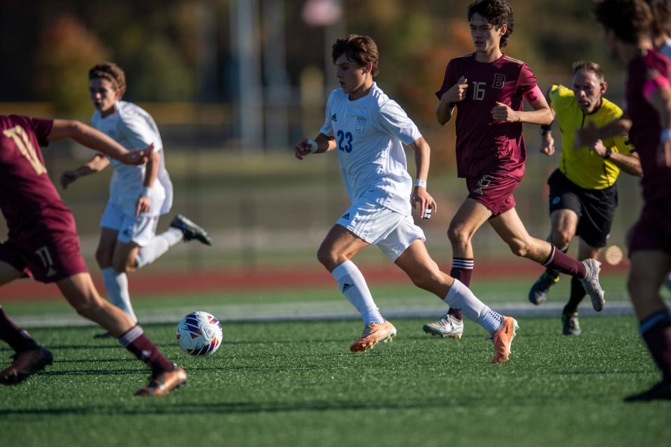 Memorial’s Cohen Havill (23) dribbles the ball as the Memorial Tigers play the Brebeuf Jesuit Braves in the IHSAA Class 2A boys soccer semistate game in Evansville, Ind., Saturday, Oct. 21, 2023.