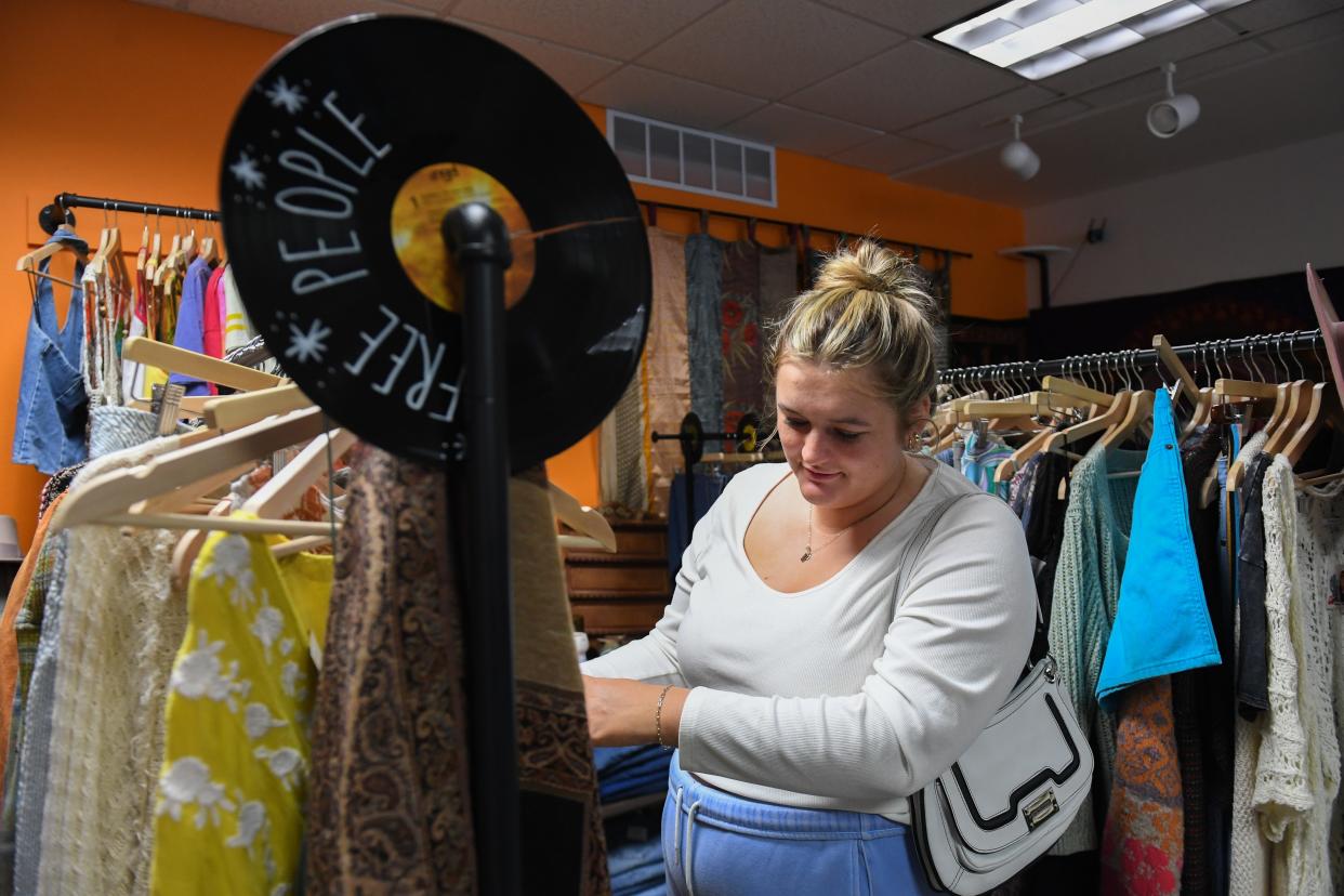 Brookings resident Paige Figland looks through the clothes racks on Saturday, April 27, 2024, at 605 Thrift in Sioux Falls. Figland and her friend went to 605 Thrift as a fun activity to do for a birthday weekend.