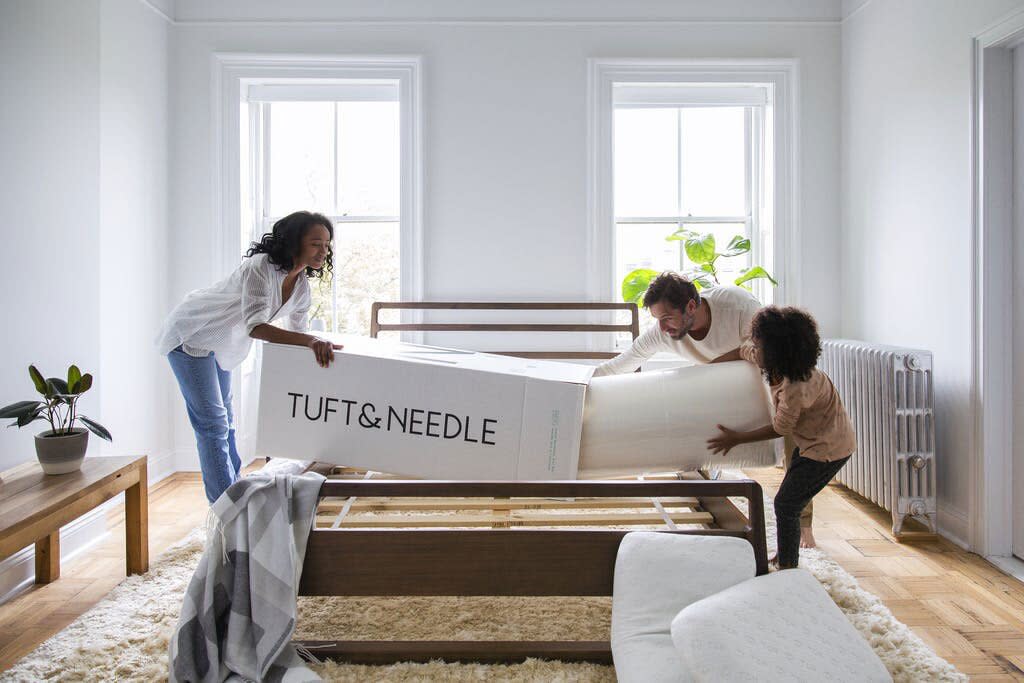 family unboxing tuft and needle mattress